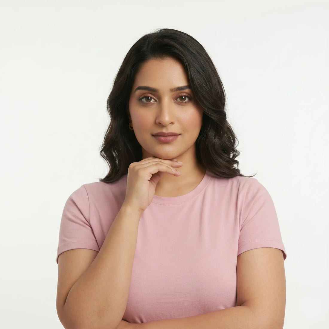 Pakistani woman with natural skin texture touching her smooth jawline, symbolizing safe options for PCOS facial hair removal and hormonal hair growth treatment.