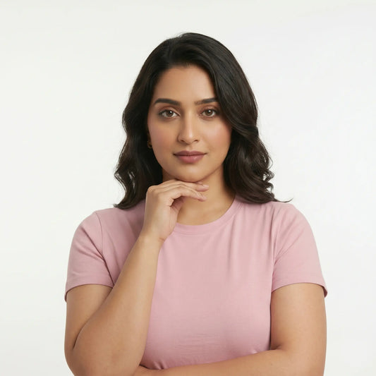 Pakistani woman with natural skin texture touching her smooth jawline, symbolizing safe options for PCOS facial hair removal and hormonal hair growth treatment.