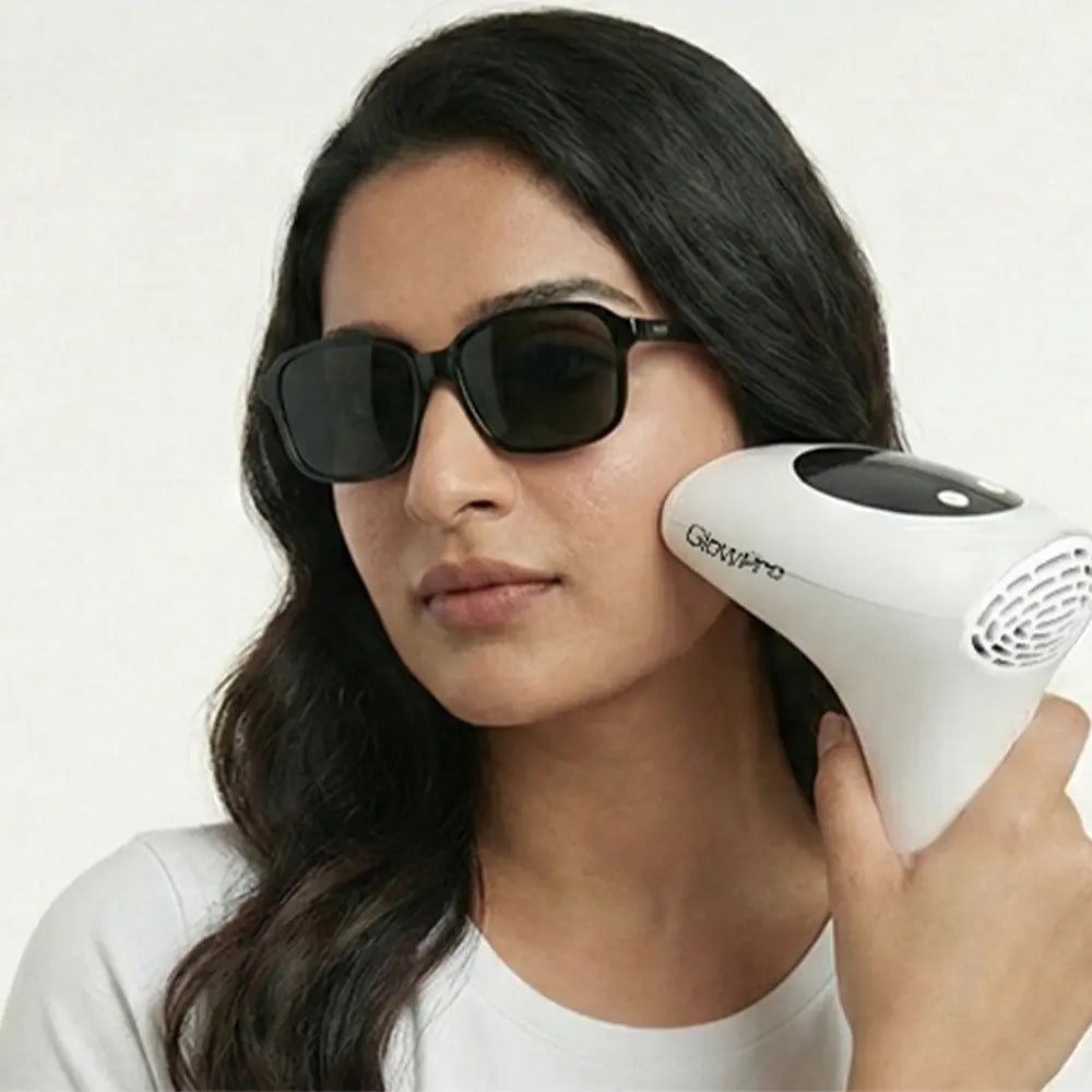 Pakistani woman demonstrating safe facial hair removal with GlowPro IPL+ and protective goggles for Pakistani skin