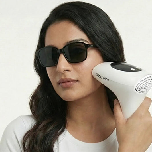 Pakistani woman demonstrating safe facial hair removal with GlowPro IPL+ and protective goggles for Pakistani skin