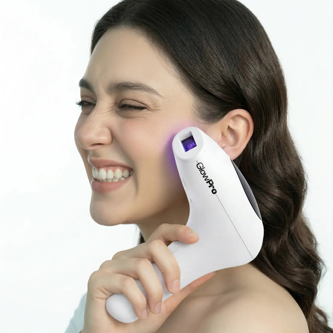 Smiling pakistani woman using the GlowPro IPL+ on her face, rated as the best IPL device in Pakistan for permanent at-home hair removal.